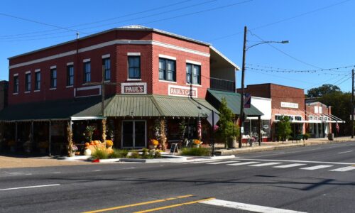 Year Built: 1927. Corner of East Pine Street and Northwest Railroad Ave. two-story brick commercial building. Paul’s Café (1976–Present)